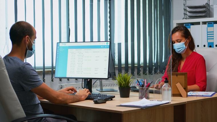 Front desk staff working on the patient appointment list